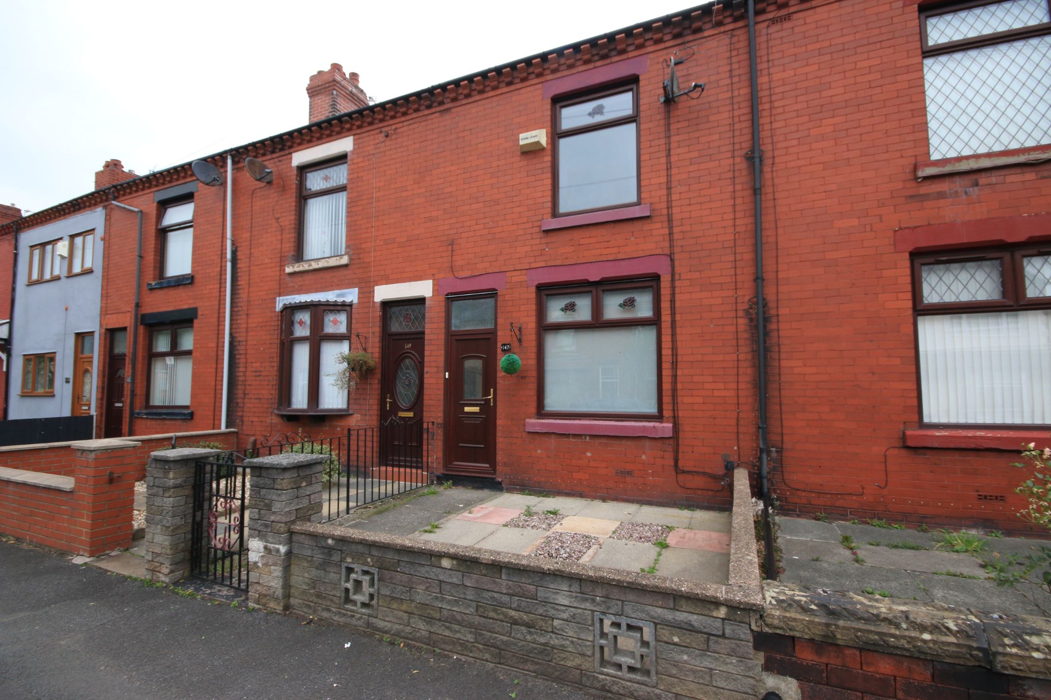 2 bedroom mid terraced house Let in Wigan - Photograph 1.