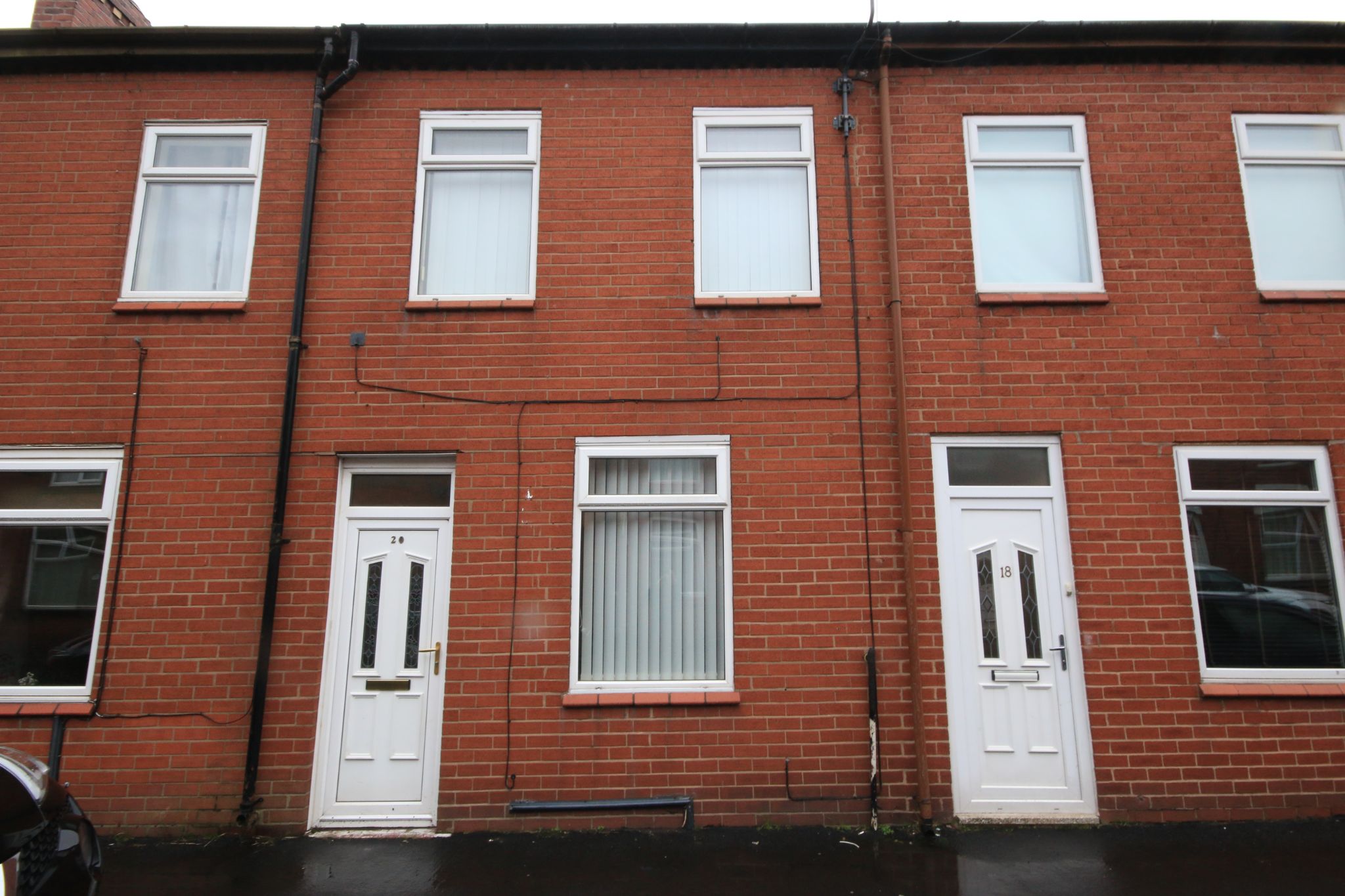 2 bedroom mid terraced house Let in Wigan - Photograph 1.