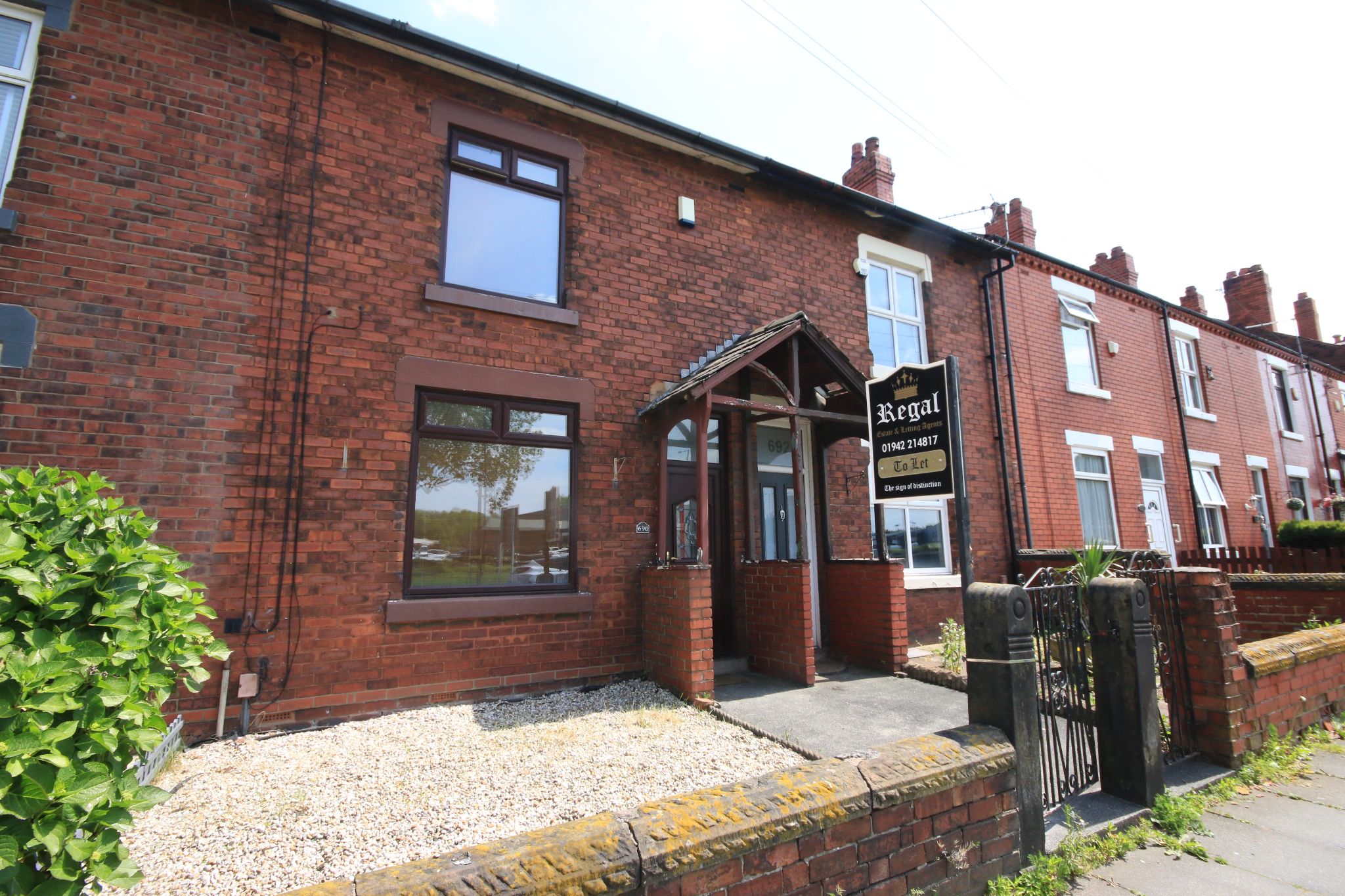 2 bedroom mid terraced house Let in Wigan - Photograph 1.