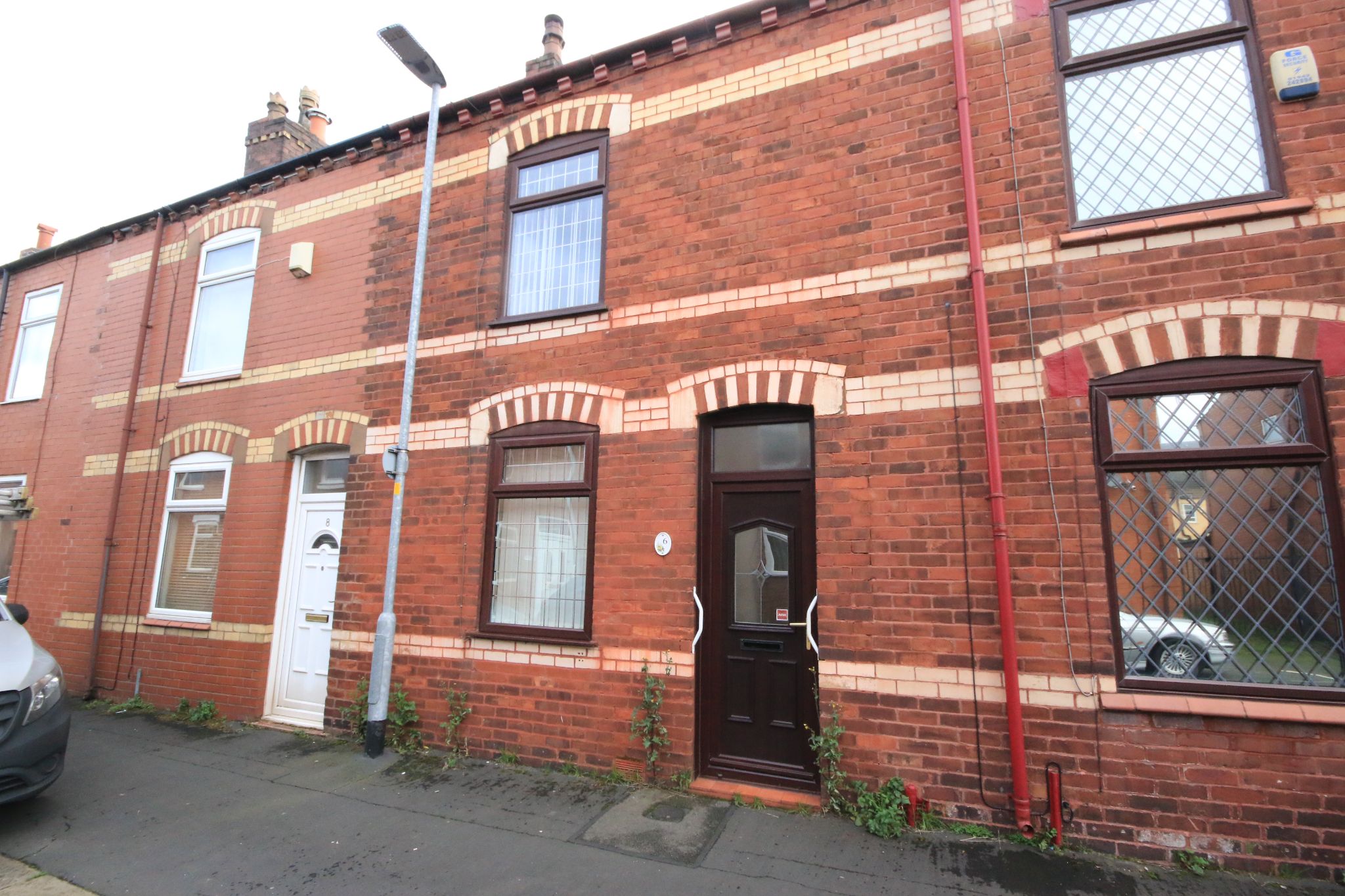 2 bedroom mid terraced house Let Agreed in Wigan - Photograph 1.