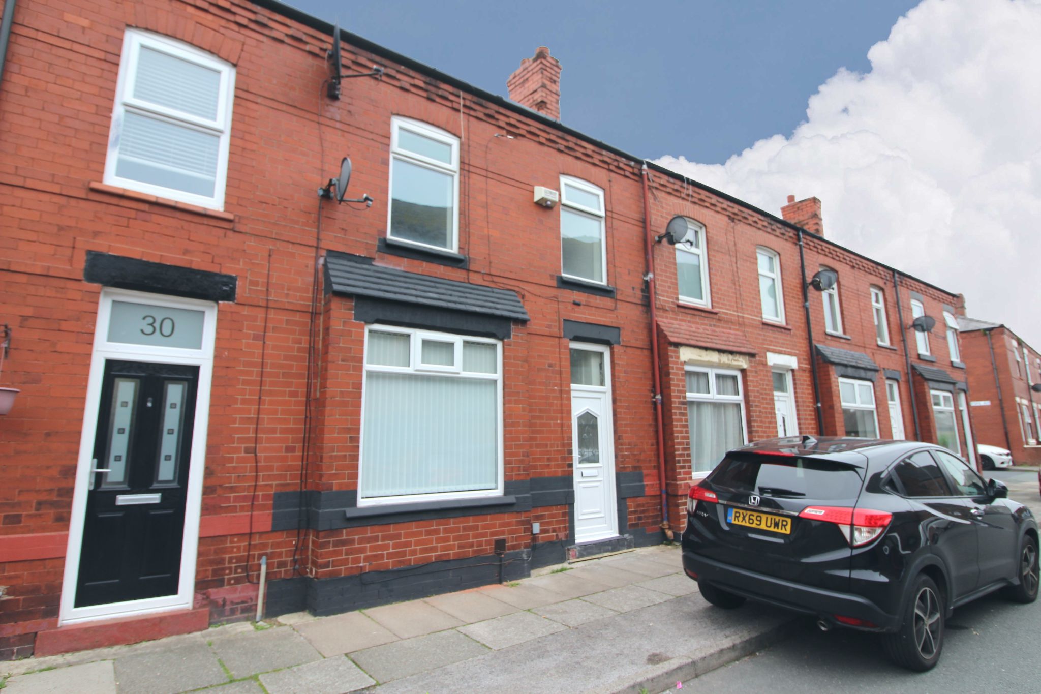 3 bedroom mid terraced house Let in Wigan - Photograph 1.