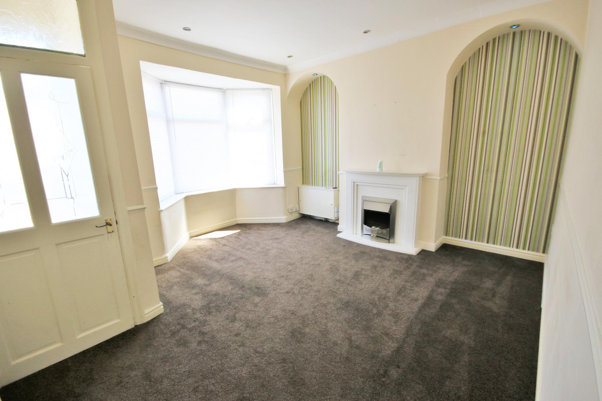 2 bedroom mid terraced house Let in Wigan - Photograph 2.