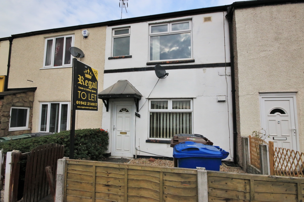 2 bedroom mid terraced house Let in Wigan - Photograph 1.