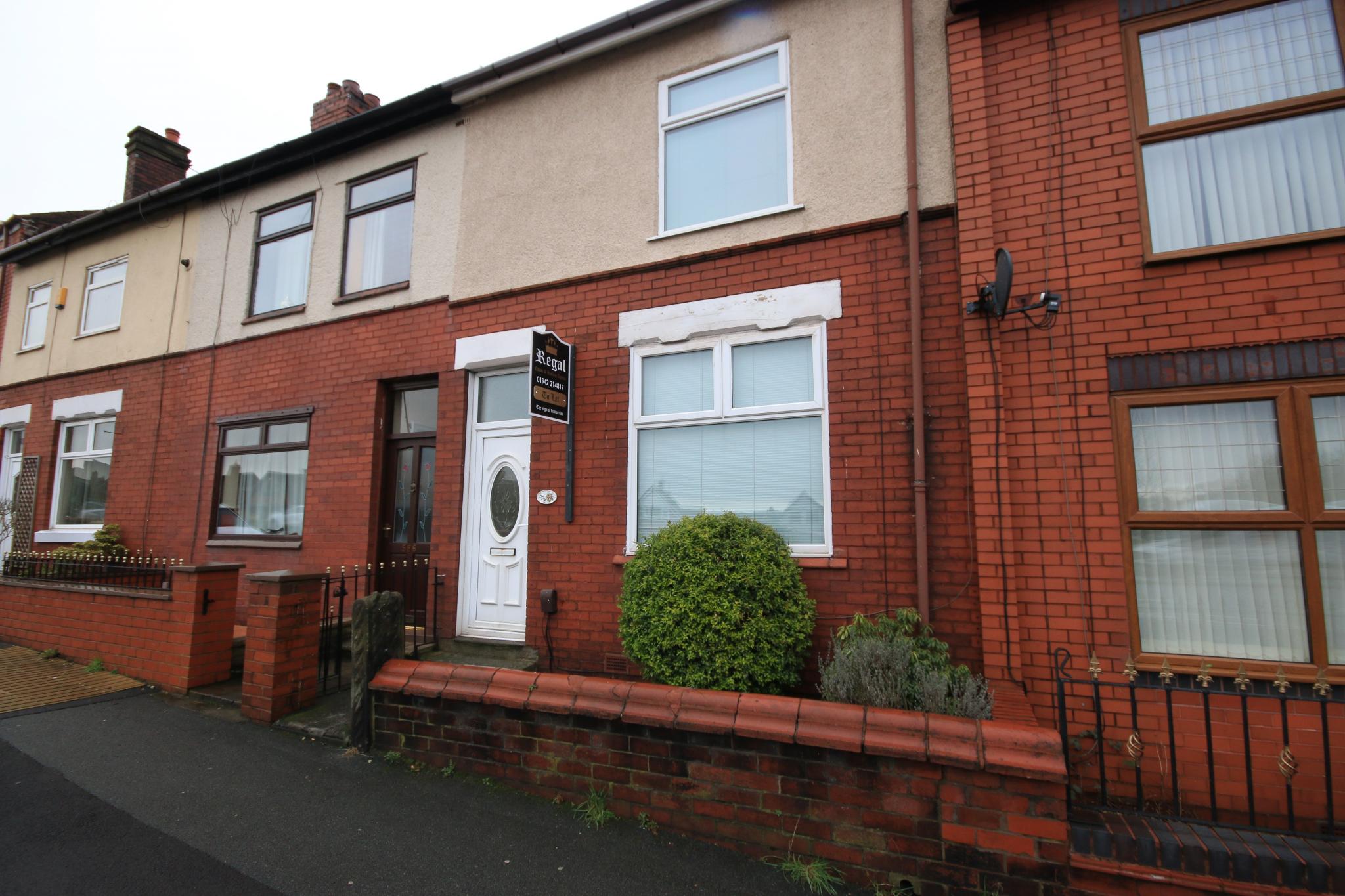 2 bedroom mid terraced house Let in Wigan - Photograph 1.