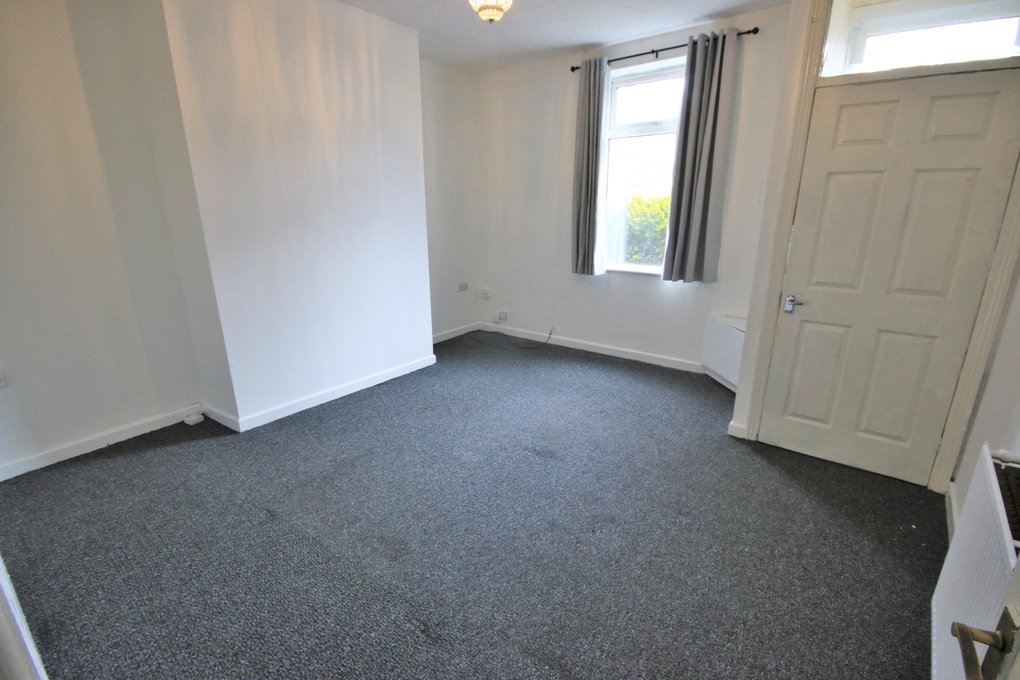 2 bedroom mid terraced house Let in Wigan - Photograph 2.