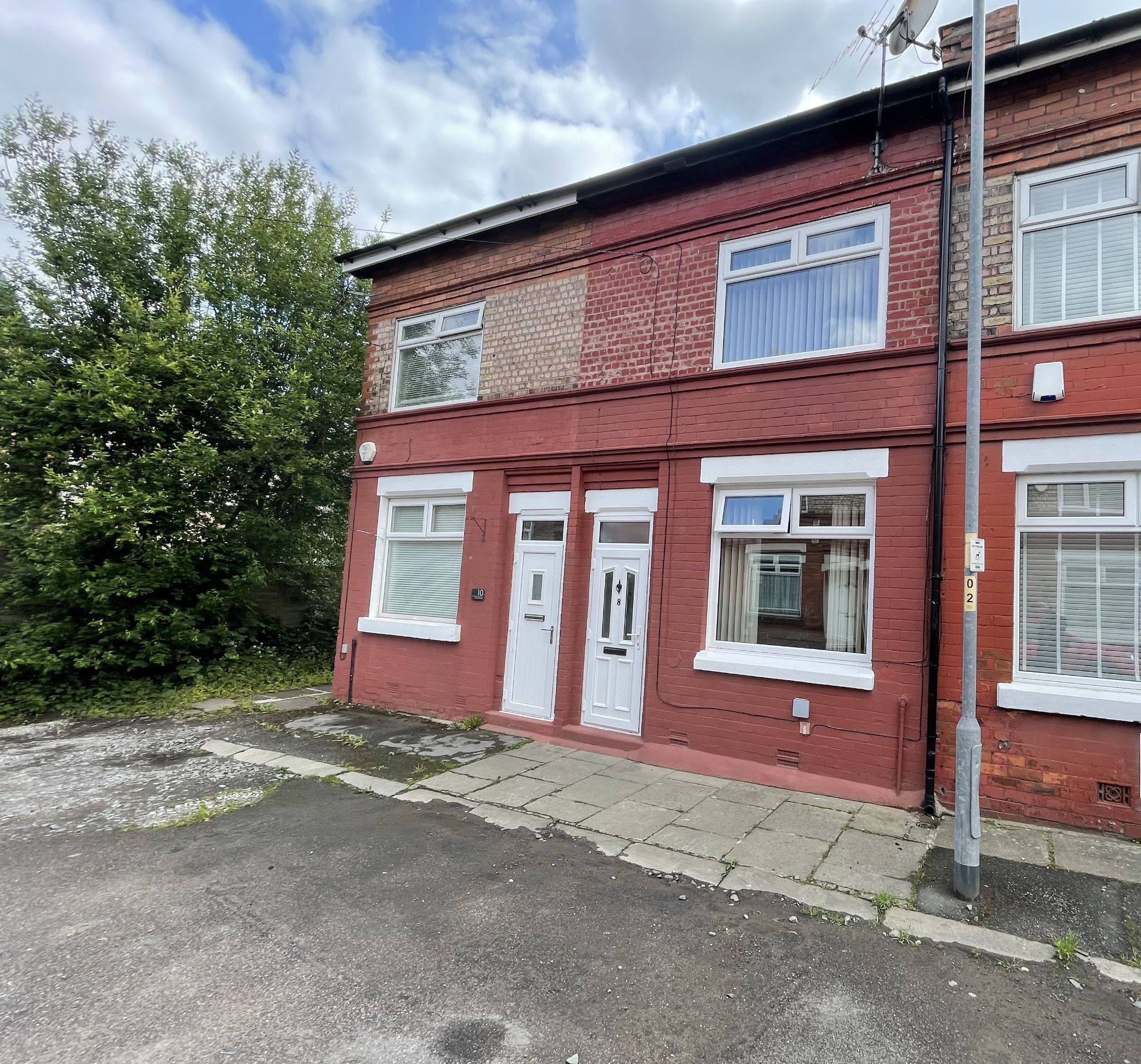 2 bedroom mid terraced house SSTC in Manchester - Photograph 1.