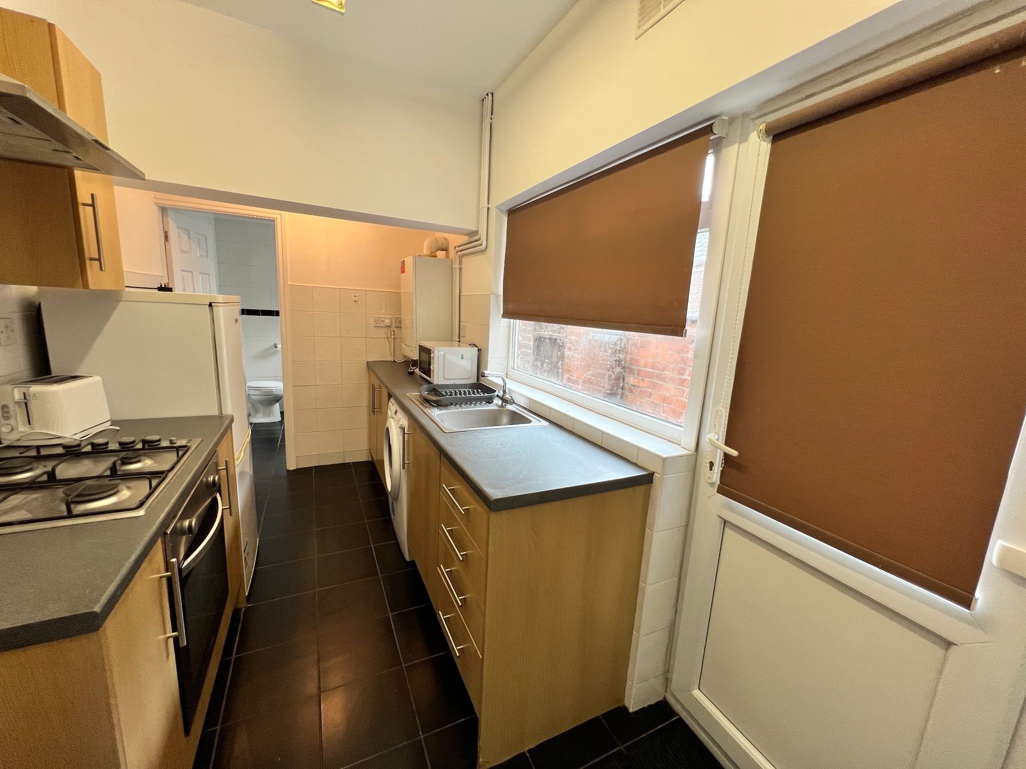 4 bedroom mid terraced house Let in Coventry - Photograph 1.